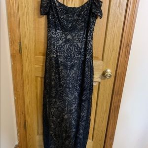 Black detailed evening gown .